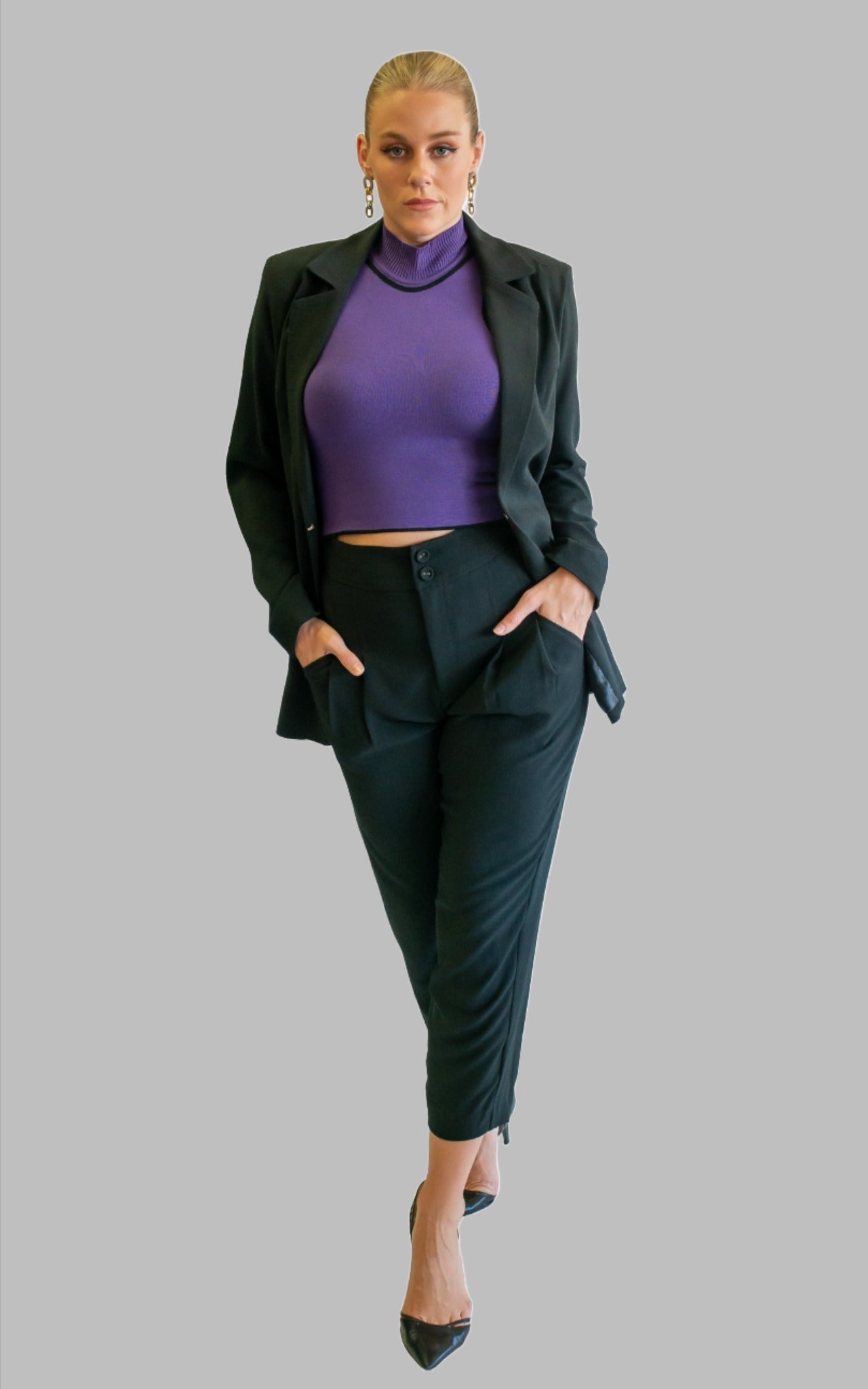 black suit with high neck top in purple sleeveless